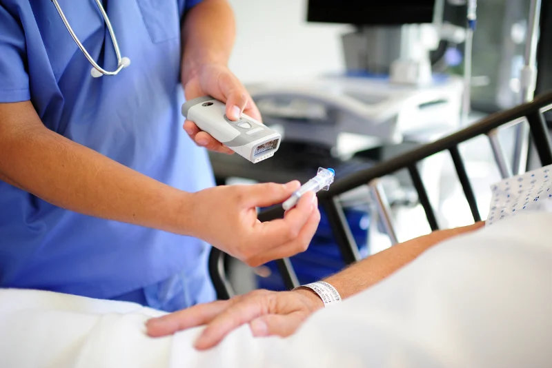 DMEA Woman scans label on a tube